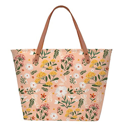 Trendy tote bag with beautiful floral design and brown leather handles.