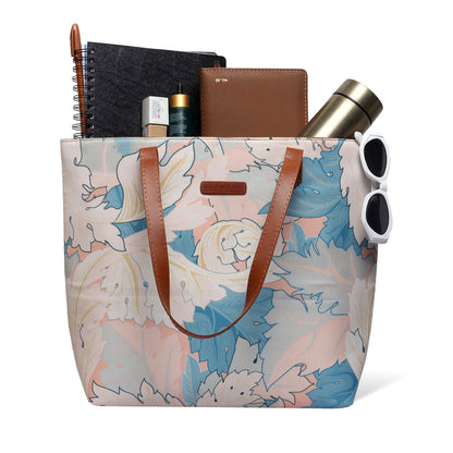 Chic tote bag featuring a beautiful floral design, ideal for adding a pop of color to your outfit.