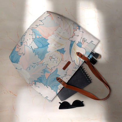 Large tote bag with vibrant floral print, a fashionable accessory for any summer ensemble.