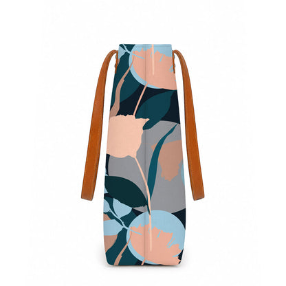 Large tote bag with floral pattern and brown handles on a white background