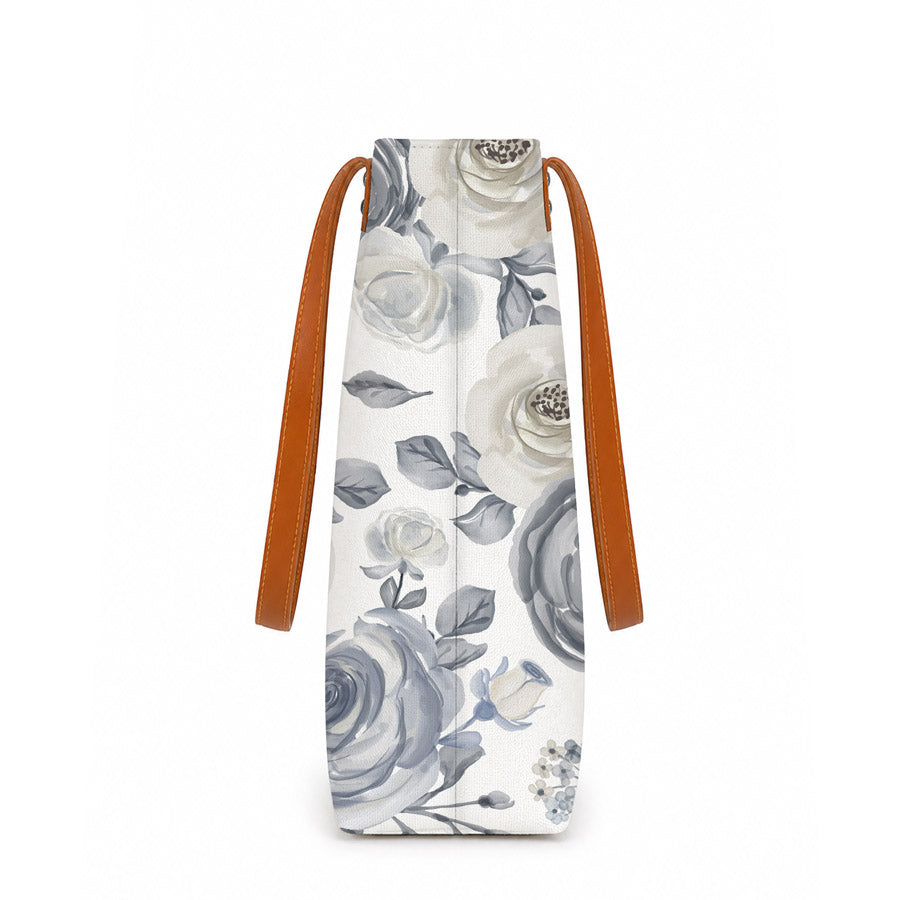 White and blue floral print tote bag, perfect for carrying essentials in style.