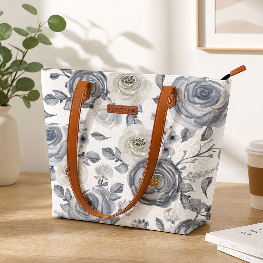 White and blue floral print tote bag, perfect for carrying essentials in style.