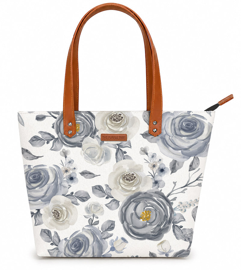 White and blue floral print tote bag, perfect for carrying essentials in style.