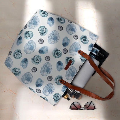 Stylish tote bag in white and blue with seashells.