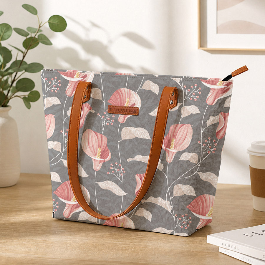 Stylish gray and pink floral tote bag, perfect for carrying essentials in style.