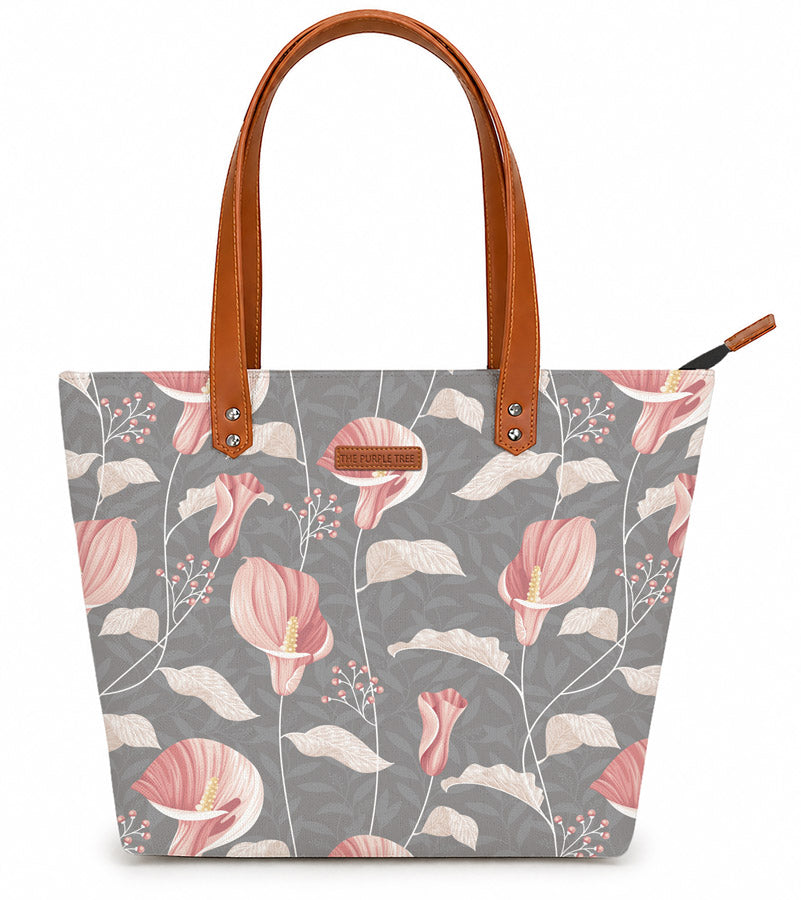 Tote bag with floral pattern and brown handles on a white background