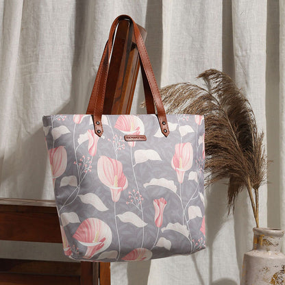 Stylish gray and pink floral tote bag, perfect for carrying essentials in style.