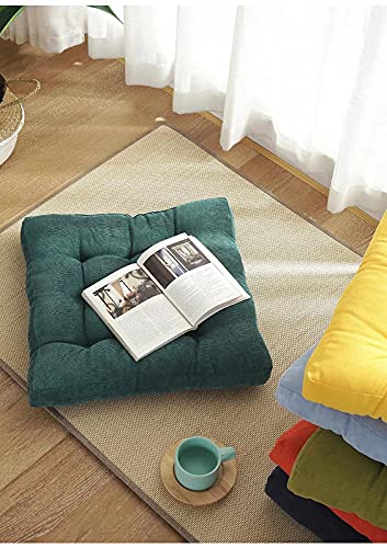 A stack of colorful cushions on a cozy carpet.