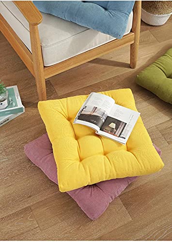Pile of colorful cushions on a comfy carpet.