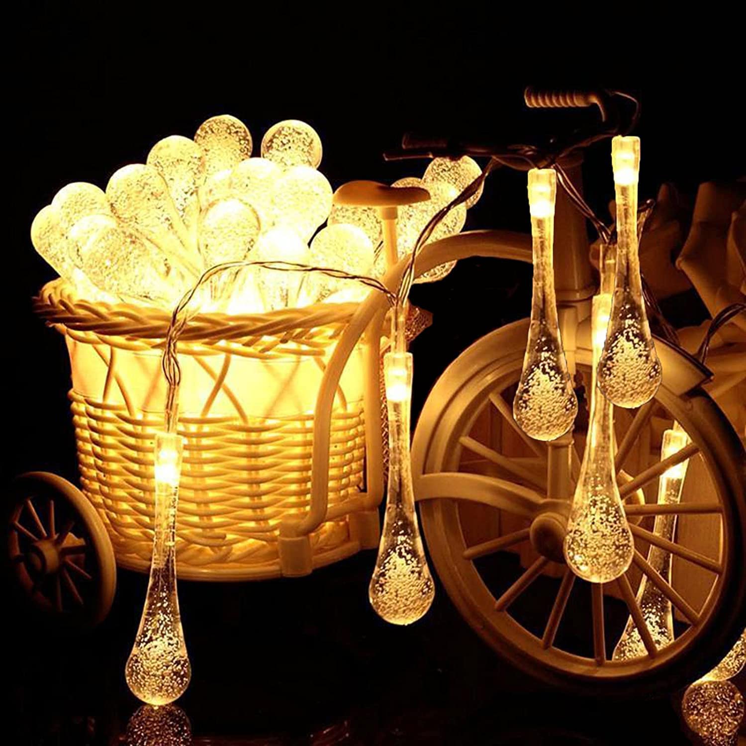 Shimmering glass droplets glowing in a line.
