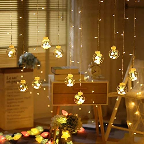A well-lit room featuring numerous decorative lights suspended from the ceiling, creating a warm and inviting atmosphere.