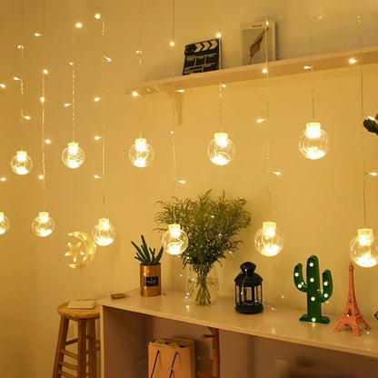 A spacious room adorned with multiple hanging lights from the ceiling, illuminating the space with a bright ambiance.
