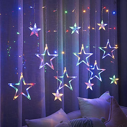  A room with a starry curtain hanging, creating a magical atmosphere.