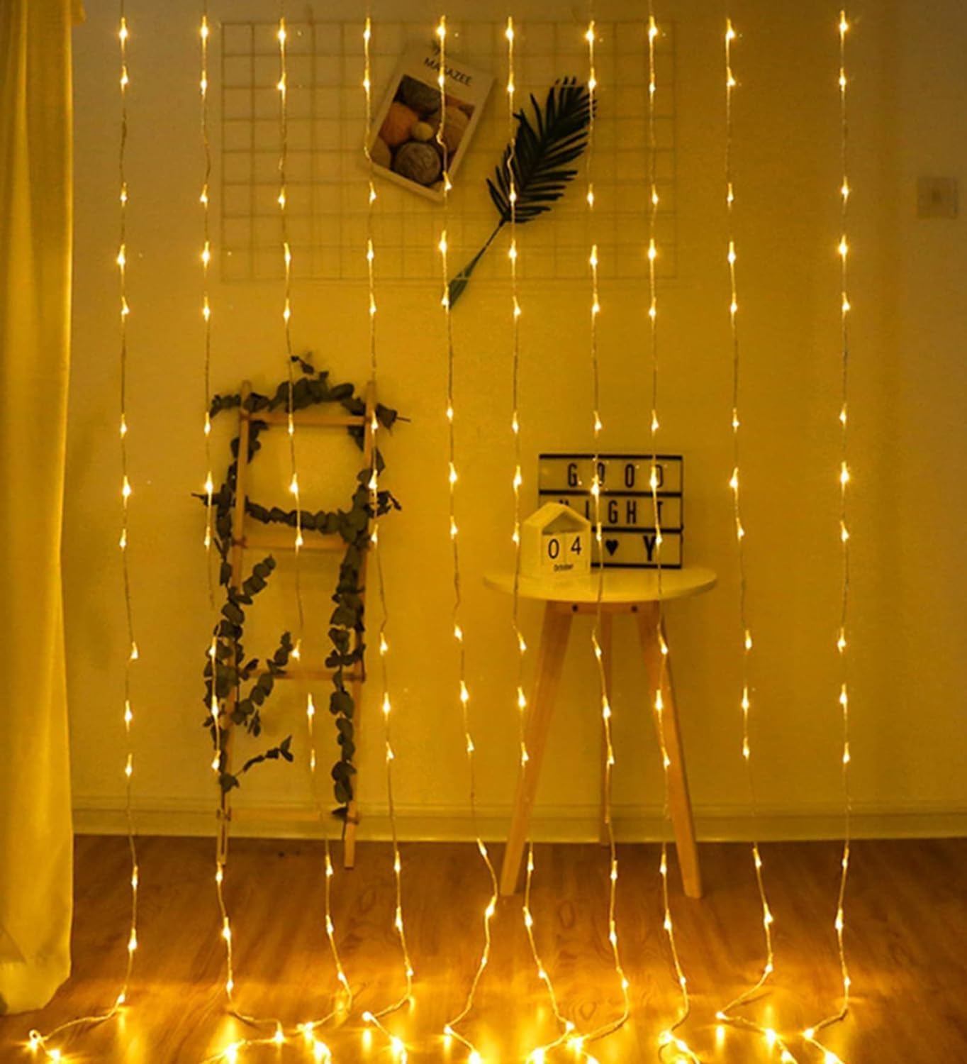 Cozy room with a curtain of string lights creating a warm and inviting atmosphere.