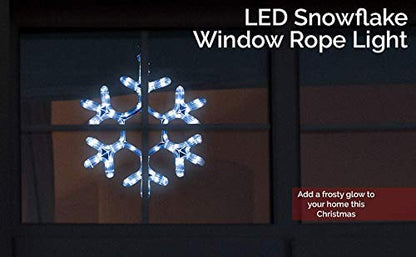  A luminous snowflake shining on a black backdrop, highlighting its delicate features and adding a touch of winter charm.