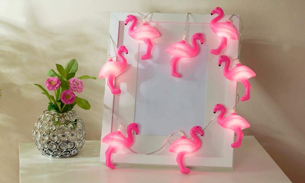 A whimsical collection of flamingos highlighted by pink lights, offering a bright and cheerful aesthetic.