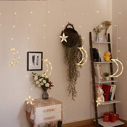 A beautifully decorated room showcasing a hanging string of stars and crescents, adding a touch of wonder to the environment.
