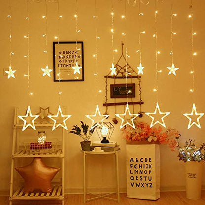 Twinkling lights hang from the ceiling, adding a festive touch to the room's ambiance.
