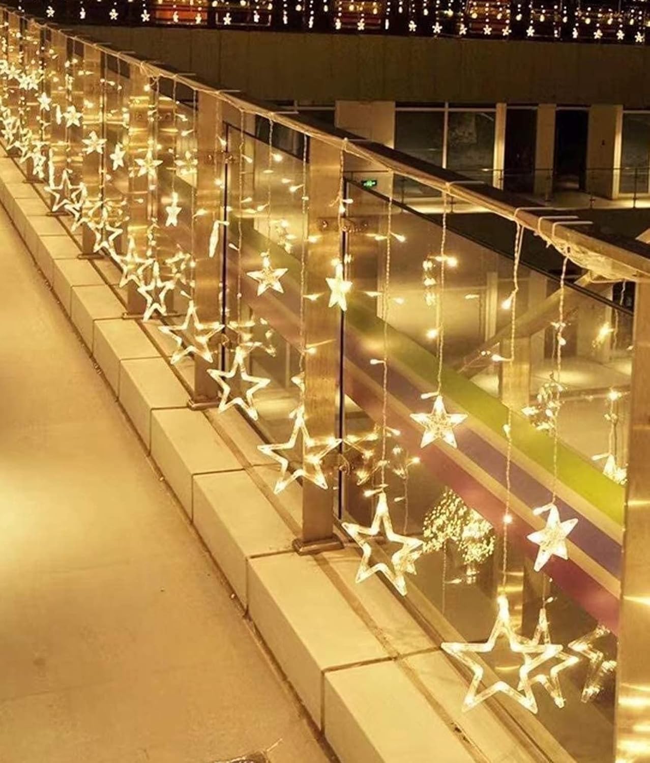 A beautiful string of lights is suspended from the ceiling, illuminating the space with a soft glow.