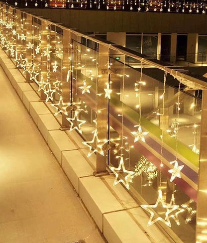 A beautiful string of lights is suspended from the ceiling, illuminating the space with a soft glow.