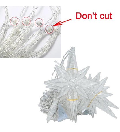 A person holding a star-shaped light-up curtain.