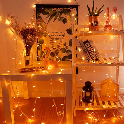 Decorative vase and book on shelf.