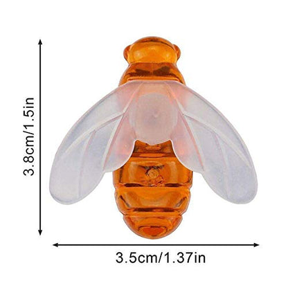 Small bee in orange color with see-through wings and body.