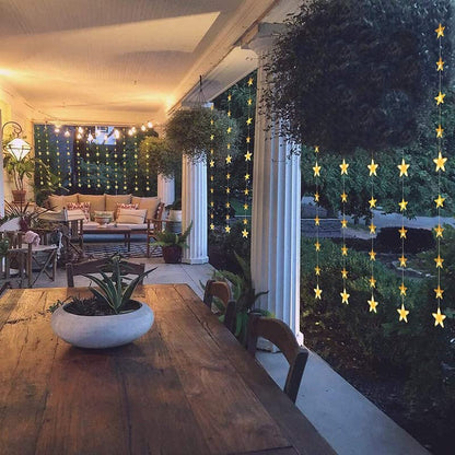 Yellow chair in a room with starry curtain, creating a warm and inviting atmosphere.