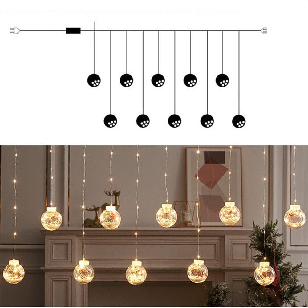 A festive Christmas ball hanging from the ceiling, adorned with twinkling lights.