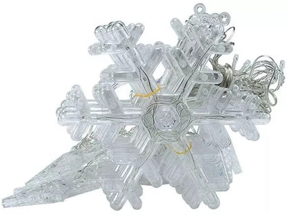 A room with a snowflake-shaped light fixture hanging from the ceiling, illuminating the space.