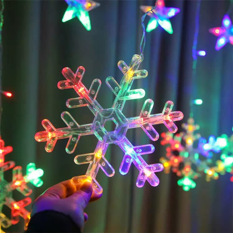 A cozy room with a beautiful snowflake hanging from the ceiling, illuminating the space with a warm glow.