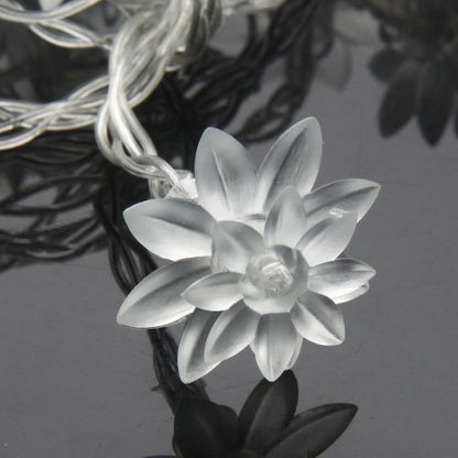 Elegant white flowers on a Christmas tree.