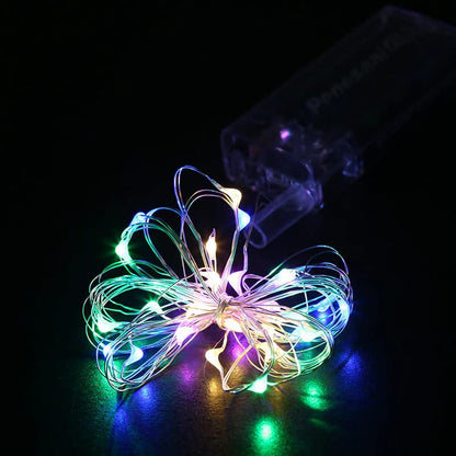 Vibrant string lights contrasted against a dark background, illuminating the space.