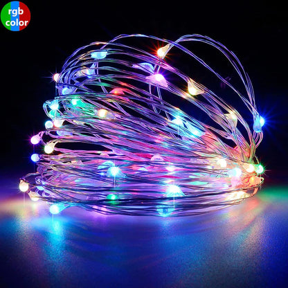  Colorful string lights against a black backdrop.
