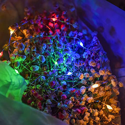 Colorful lights on a dark surface.