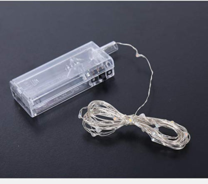 Bright string lights on black.