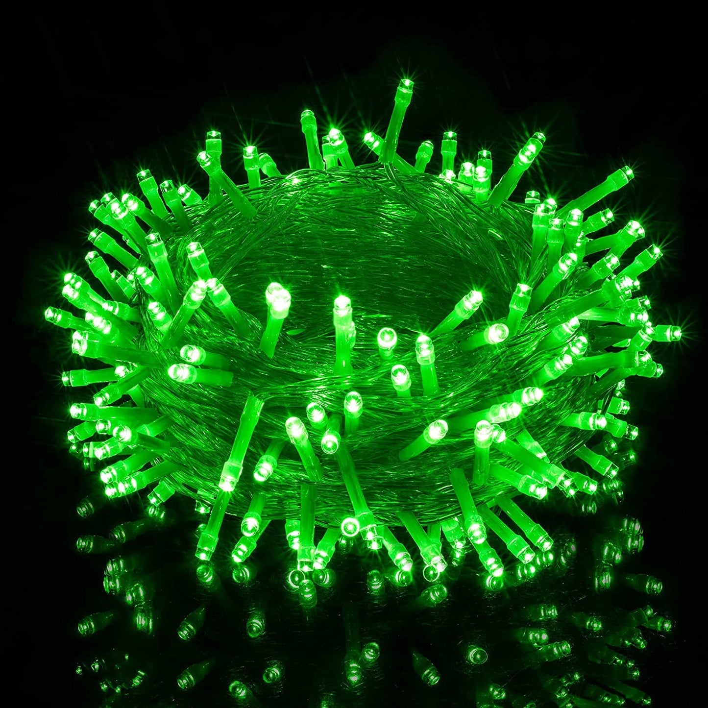 Green Christmas light shining with a multitude of bulbs.