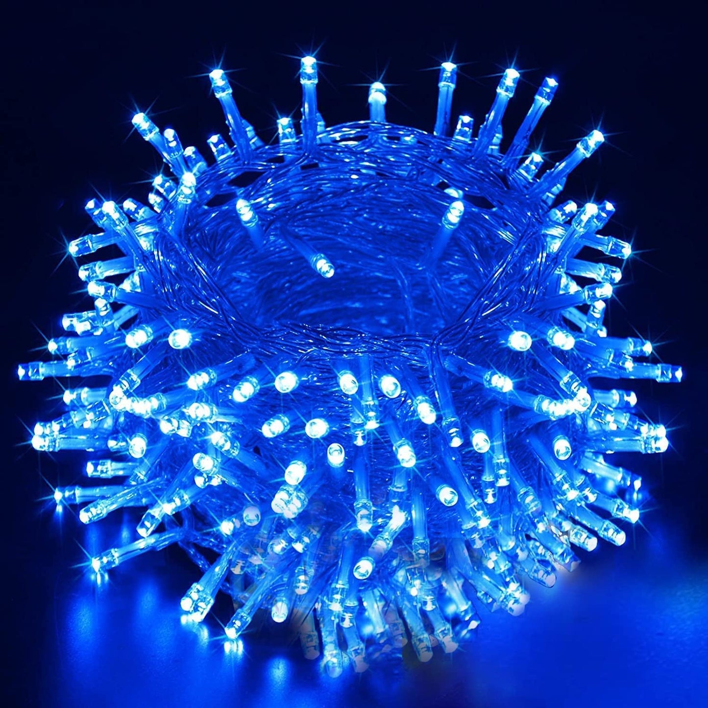 Blue LED Christmas lights shining brightly on a festive holiday tree, creating a magical and enchanting atmosphere.