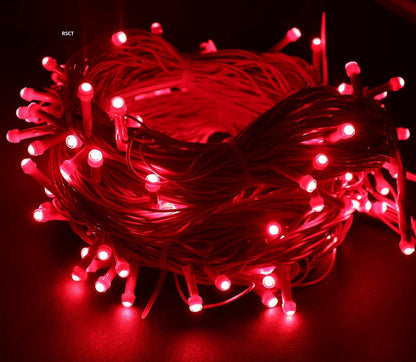 A decorative display featuring a red string of lights intertwined with white lights, creating a festive ambiance.
