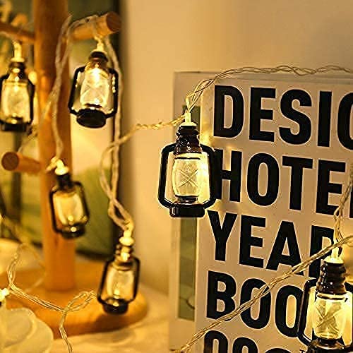 A book with a sign that says " design" on a wooden table.