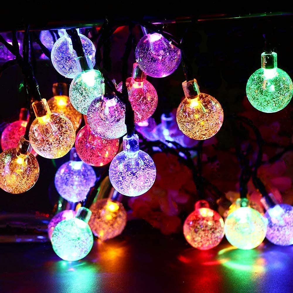  Vase adorned with bright, colorful lights for a cheerful and decorative touch.