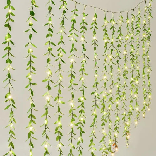 Green curtain with hanging lights, creating a cozy and inviting atmosphere.