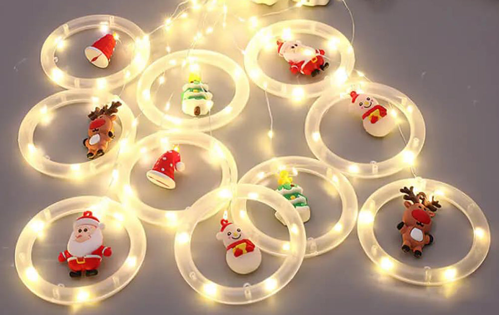 Santa Claus with festive lights on a hanging ring.