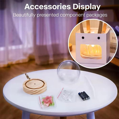 A glass ball showcasing a collection of flowers inside, blending artistry with the natural charm of floral arrangements.
