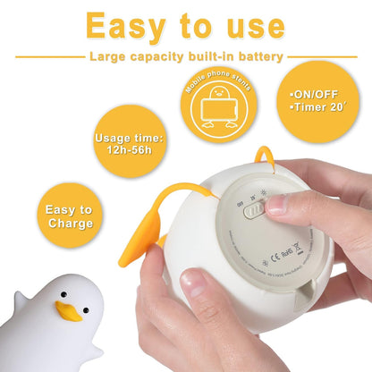  A white duck is seen with a box and a charger, offering a quirky and captivating visual moment.