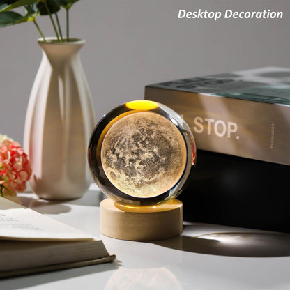 A beautiful moon ball on a table, surrounded by blooming flowers, creating a peaceful and inviting scene.