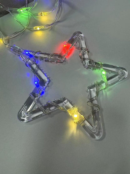 A cozy room featuring vibrant Christmas lights suspended from the ceiling, enhancing the holiday spirit.