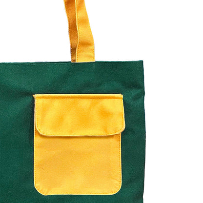 Stylish green and yellow tote bag featuring a convenient yellow pocket for easy access.