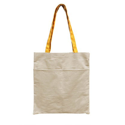 Canvas tote bag featuring a vibrant yellow pocket.