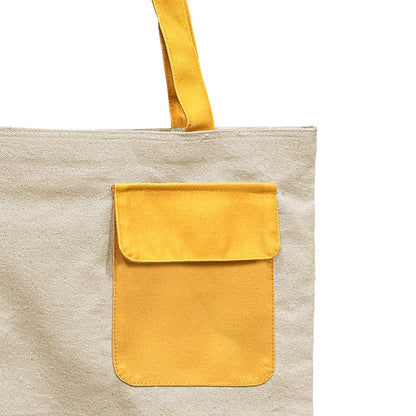 Picture of a tote bag with a sunny yellow pocket.